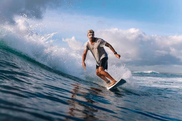 Surfer on a wave, Bali, Indonesia model released Symbolfoto KNTF04505