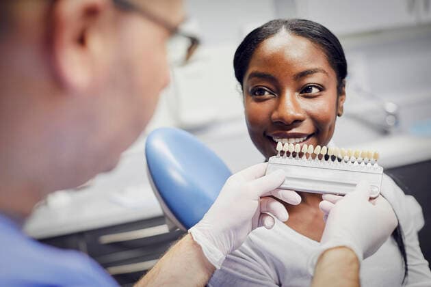 Patient getting dental teeth whitening treatment model released Symbolfoto property released PWF00028