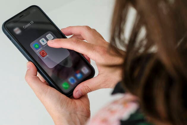 Illustration picture shows a smartphone with a corona virus tracking app, in Antwerp, Friday 24 April 2020. It is not yet clear which app or apps will be selected by the government in a possible exit strategy from the corona protection measures that are in place since six weeks.  DIRKxWAEM 2497237