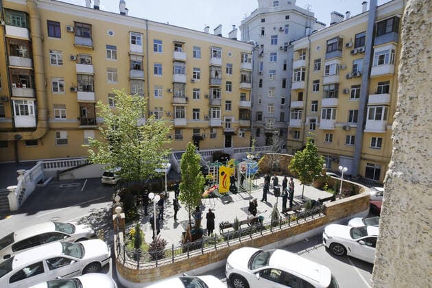 ROSTOV-ON-DON, RUSSIA - APRIL 25, 2020: Singers of the Song and Dance Ensemble of the Russian Army Southern Military District (C) perform outside a block of flats to cheer up people who have to stay at home due to lockdown measures amid the pandemic of the novel coronavirus disease (COVID-19). The open-air concert is part of a series of concerts, which the military musicians plan to perform in various residential areas of the city ahead of the forthcoming 75th anniversary of Soviet Victory in the Great Patriotic War (part of WWII). Rostov-on-Don has been on lockdown since 31 March 2020. Valery Matytsin TASS  TS0D70AC