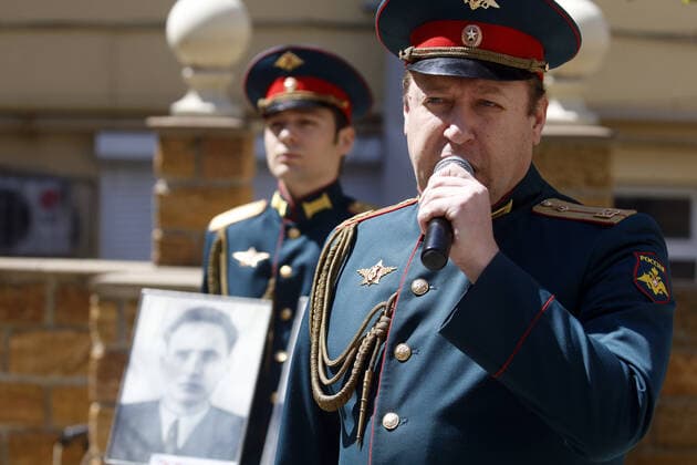 ROSTOV-ON-DON, RUSSIA - APRIL 25, 2020: Singers of the Song and Dance Ensemble of the Russian Army Southern Military District perform outside a block of flats to cheer up people who have to stay at home due to lockdown measures amid the pandemic of the novel coronavirus disease (COVID-19). The open-air concert is part of a series of concerts, which the military musicians plan to perform in various residential areas of the city ahead of the forthcoming 75th anniversary of Soviet Victory in the Great Patriotic War (part of WWII). Rostov-on-Don has been on lockdown since 31 March 2020. Valery Matytsin TASS  TS0D70AD