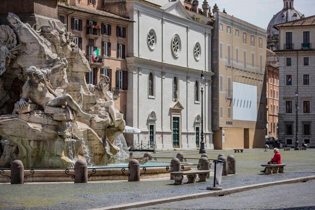 Rome: Coronavirus cases drop down A woman sits on a bench in Piazza Navona empty square in Rome during the Coronavirus (Covid-19) emergency Rome Italy Italy Copyright: DavidexFracassi