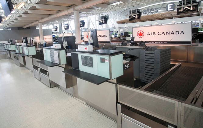 (200427) -- TORONTO, April 27, 2020 -- Photo taken on April 27, 2020 shows check-in counters of Air Canada at Pearson International Airport in Toronto, Canada. Air Canada suspended all scheduled flights to the United States for four weeks starting on Monday. As of Monday afternoon, there were 48,230 confirmed COVID-19 cases in Canada and 2,701 deaths. (Photo by Xinhua) CANADA-TORONTO-COVID-19-AIR CANADA-FLIGHTS TO U.S.-SUSPENSION ZouxZheng 