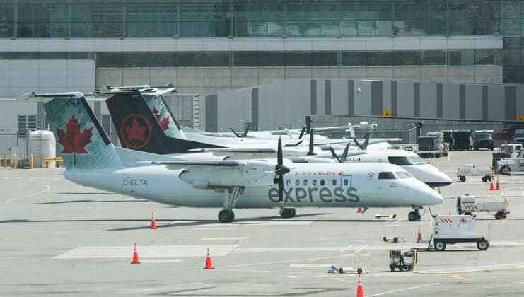 (200427) -- TORONTO, April 27, 2020 -- Planes of Air Canada are seen at Pearson International Airport in Toronto, Canada, April 27, 2020. Air Canada suspended all scheduled flights to the United States for four weeks starting on Monday. As of Monday afternoon, there were 48,230 confirmed COVID-19 cases in Canada and 2,701 deaths. (Photo by Xinhua) CANADA-TORONTO-COVID-19-AIR CANADA-FLIGHTS TO U.S.-SUSPENSION ZouxZheng 