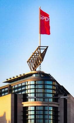 SPD flag on the roof of the Willy Brandt House in Berlin, the federal headquarters of the German Social Democratic Party