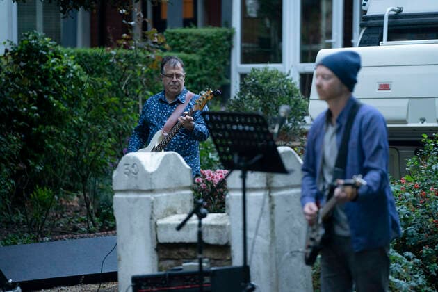 (200501) -- MANCHESTER, May 1, 2020 (Xinhua) -- Residents of the Wood Road in Chorlton play instruments in a street concert as part of the weekly Clap for Our Carers in Manchester, Britain, on April 30, 2020. (Photo by Jon Super Xinhua) BRITAIN-MANCHESTER-COVID-19-STREET CONCERT 
