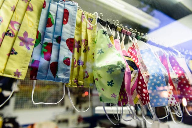 May 1, 2020, Berlin, Berlin, Germany: Hand made, patterned masks for sale hanging in a windows of a tailor shop in Berlin Schoeneberg. People in Berlin have to wear a face mask in city buses, subway and underground trains and in the partly reopened retail sector as well as in contact with persons at risk. As there is still a lack of respiratory masks and protective equipment among doctors and hospitals, many entrepreneurs offer self-made, non-medical masks for sale. Berlin Germany - ZUMAs172 20200501_zap_s172_008 Copyright: xJanxScheunertx