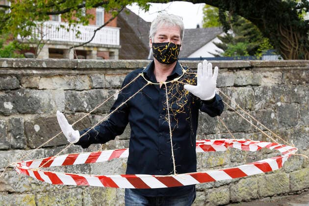 BODYART artist Jörg Düsterwald in his Corona Crisis Outfit with the experimental prototype of a spacer If all people would wear such barriers, the necessary distances would be maintained Düsterwald wears a self-made mouthguard matching the shirt of his own individual fashion collection from his project FASHION ART Hameln, 02 05 2020 Foto:xT.xSkupinx xFuturexImage