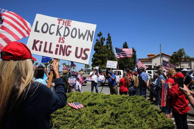 May 2, 2020, Santa Maria, California, United States: A protester holds a placard that says the Lockdown is Killing Us during the demonstration..In Santa Maria nearly one hundred people gathered to protest the California stay-at-home orders and to call for the reopening of small businesses in California. Santa Maria United States - ZUMAs197 20200502_zaa_s197_284 Copyright: xStantonxSharpex