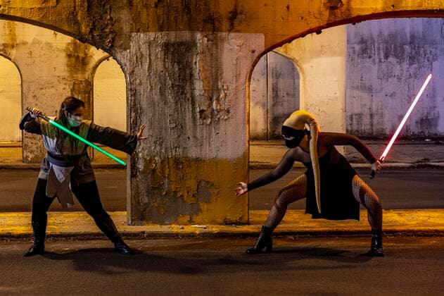 May 3, 2020, Chicago, Illinois, U.S: TWILA YORK and ALICJA JANUZKO square off with Lightsabers drawn, at a safe distance apart on a normally busy Chicago side street. Chicago U.S. - ZUMAr170 20200503_znp_r170_011 Copyright: xChrisxRihax