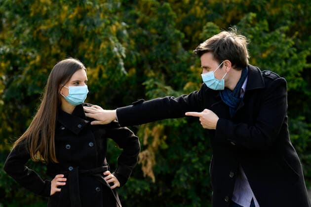 Young couple with face mask, insisting on distance, corona crisis, Karlsruhe, Baden Württemberg, Germany Coronavirus