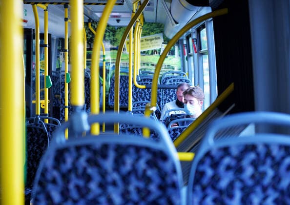 14 12 2019, xlakx ,Berlin BVGl emspor, v l Two young men wear protective masks to guard against the novel coronavirus while riding on a BVG bus Berlin
