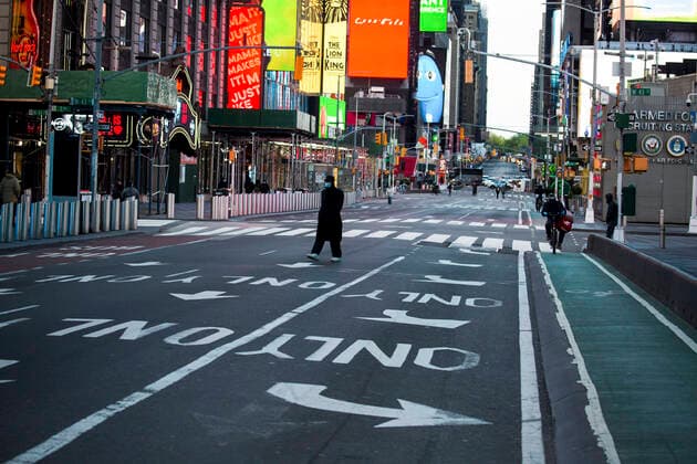 (200510) -- NEW YORK, May 10, 2020 -- A pedestrian in face mask walks through Times Square amid the COVID-19 outbreak in New York, the United States, May 9, 2020. The number of COVID-19 cases in the United States reached 1,300,079 as of 3:32 p.m. (1932 GMT) Saturday, according to the Center for Systems Science and Engineering (CSSE) at Johns Hopkins University. Meanwhile, the death toll from the disease in the country hit 78,320. (Photo by Xinhua) U.S.-COVID-19 CASES-UPDATE MichaelxNagle