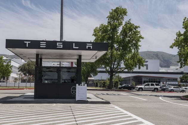 The main entrance to the Tesla Factory is seen in Fremont, California on Sunday, May 10, 2020. Shelter in place orders because of coronavirus have closed the plant. In a series of tweets Saturday, Tesla CEO Elon Musk threatened to move the company s headquarters to Texas or Nevada, where shelter-in-place rules are less restrictive.  SXP2020051001 TERRYxSCHMITT