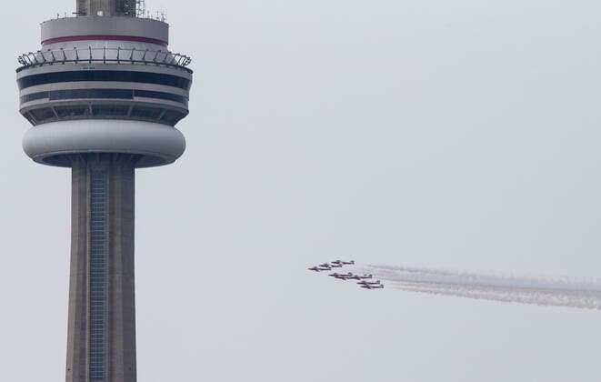 (200510) -- TORONTO, May 10, 2020 -- A formation of the Canadian Forces Snowbirds fly as part of their Operation Inspiration Tour during the COVID-19 outbreak over Toronto, Canada, on May 10, 2020. From the first weekend of May, the cross-country tour is expected to salute Canadians doing their part to fight the spread of COVID-19. (Photo by Xinhua) CANADA-TORONTO-COVID-19-SNOWBIRDS-FLYOVER ZouxZheng 