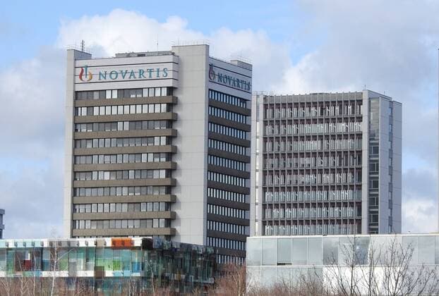 12 02 2020 Basel ,Switzerland In the picture Novartis high-rise logo lettering, real estate chemical industry
