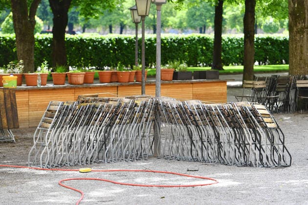 Theme picture Coronavirus pandemic Gastronomy in Bavaria in front of gradual opening Stacked chairs and tables of a beer garden in the Hofgarten in Munich on 12 05 2020 From 18 May onwards, beer gardens and outdoor gastronomy may welcome guests again