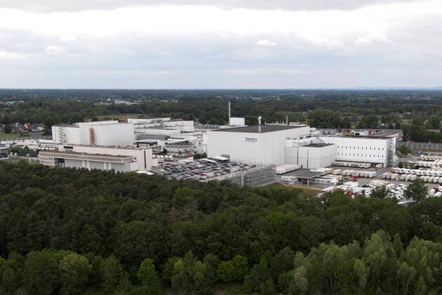 Tönnies Fleischwerk Tönnies Wirtschaft Aerial view with a drone of the outside area of Tönnies Lebensmittel GmbH Co KG in Rheda Wiedenbrück North Rhine-Westphalia Left the Tönnies Arena, right truck drivers deliver the slaughtered animals to Rheda Wiedenbrück North Rhine-Westphalia Germany Copyright: xInderlied Kirchner-Mediax