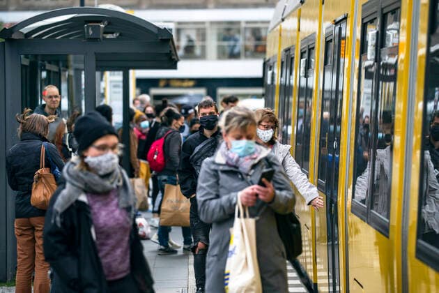 People wearing a face mask get on a BVG tram in Berlin on 16 May 2020 Coronavirus in Berlin