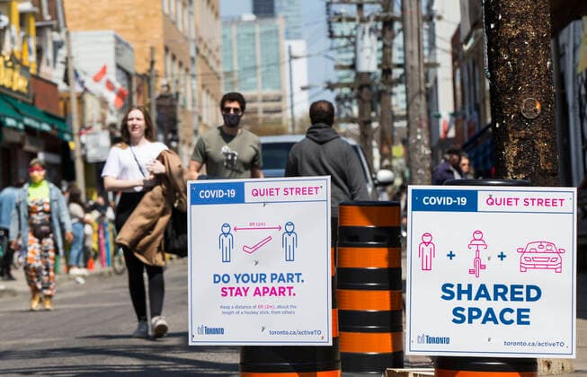 (200516) -- TORONTO, May 16, 2020 -- Signs of Quiet Street are seen on a street in Toronto, Canada, on May 16, 2020. The City of Toronto transformed sections on major roads into quiet streets to provide more space for people to be physically active and improve physical distancing due to the COVID-19 outbreak during the long weekend. (Photo by Xinhua) CANADA-TORONTO-COVID-19-MEASURES-QUIET STREETS ZouxZheng 