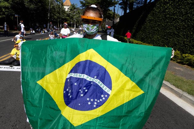 May 18, 2020: Residents of the community of Paraisopolis, south of SoÂ£o Paulo, held a protest today against the lack of assistance from governments in the coronavirus crisis..Residents mainly demand the return of the water supply, the performance of Covid-19 tests, ambulances, food and hygiene items, among other demands..The demonstration headed for the headquarters of the state government palace, Palacio dos Bandeirantes, was intercepted by the military police, generating even more outrage, as, as users of social networks commented, in the fascist acts of the Bolsonarists, the PM does not appear. But, it is always ready to suppress the poor population. - ZUMAo70_ 20200518_zap_o70_005 Copyright: xDarioxOliveirax