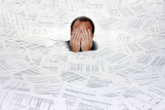 Man suffocates in a pile of paper, Stress through too much bureaucracy, Austria man between documents, too much bureaucracy, Austria BLWS616930 Copyright: xblickwinkel McPHOTO BilderBoxx