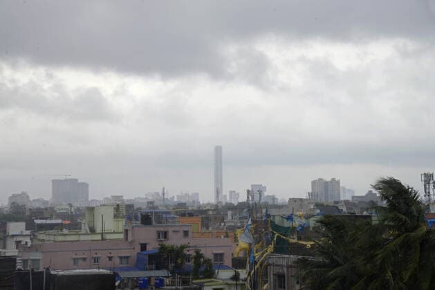 India: Landfall of Cyclone Amphan Dark clouds hover over city during the cyclonic storm Amphan. Kolkata West Bengal India Copyright: VedxPrakash