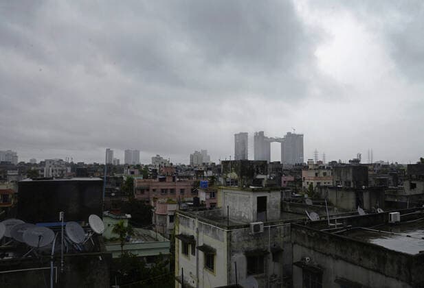 India: Landfall of Cyclone Amphan Dark clouds hover over city during the cyclonic storm Amphan. Kolkata West Bengal India Copyright: VedxPrakash