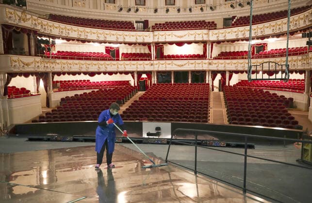 MINSK, BELARUS - MAY 22, 2020: A worker washing the floor of a stage of the National Academic Bolshoi Opera and Ballet Theater of the Republic of Belarus. Natalia Fedosenko TASS  TS0DA014