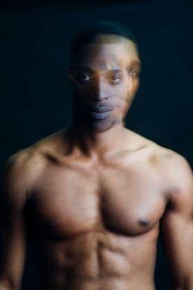 Double exposure portrait of nude young man in studio model released Symbolfoto MEUF00547