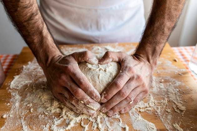 Mans hands shaping heart on dough ball model released Symbolfoto  WPEF02885
