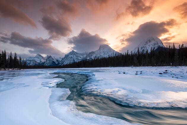 Athabasca River in winter with mountain backdrop, Alberta, Canada, North America Copyright: EdxRhodes 1306-744