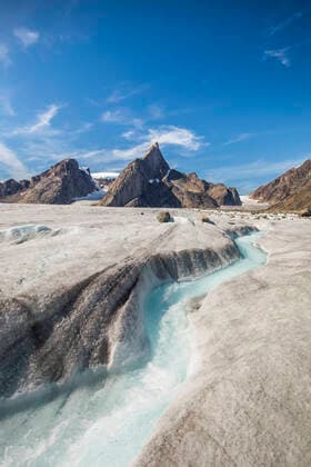 River meanders through a glacier below Mount Loki, Baffin Island. Pangnirtung, NU, Canada CR_JDIP200518-319598-01