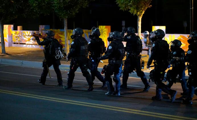 June 1, 2020, Albuquerque, NEW MEXICO, USA: 060120 ..Albuquerque Police Officers dressed in riot gear make their way North on 3rd Street in Downtown Albuquerque as they begin to clear the area after a peaceful rally turned violent l in light of the recent killing of George Floyd by police officers in Minneapolis .Photographed on Monday June 1, 2020.Adolphe Pierre-LouisJournal. Albuquerque USA - ZUMAab1_ 20200601_zaf_ab1_002 Copyright: xAlbuquerquexJournalx