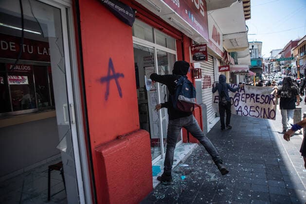 June 8, 2020, Xalapa, Veracruz, Mo xico: Hooded people and anarchists protest in the city of Xalapa in order to demand justice for the murder of Carlos Navarro, who lost his life within the state police separatives after being arrested. These protests join the international movement against police violence Xalapa MÃ xico - ZUMAqp1_ 20200608_zip_qp1_024 Copyright: xHectorxAdolfoxQuintanarxPerezx