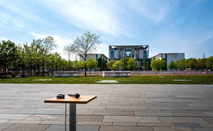 Microphone on a table in front of the Federal Chancellery in Berlin 1020915646