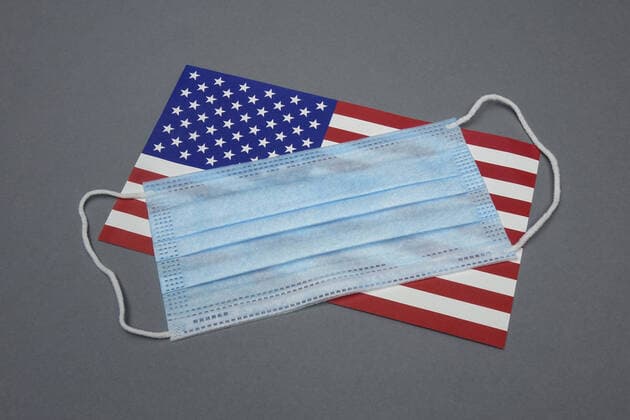 Mask and National Flag Mask and National Flag, 14 06 2020, Borkwalde, Brandenburg, Germany, A face mask is on the national flag of the USA