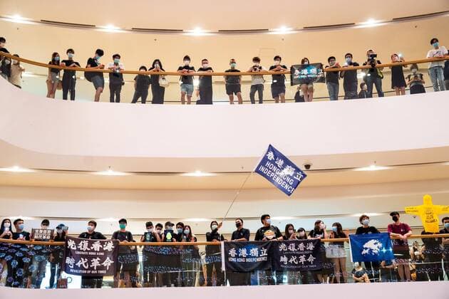 June 15, 2020, Hong Kong, China: A Hong Kong revolution flag seen waved by protesters in a shopping mall during a demonstration..Thousands of pro democracy protesters gather to mark the one-year anniversary of the death of Leung, who fell to his death during a rally against a controversial extradition bill proposal last year. Hong Kong China - ZUMAs197 20200615_zaa_s197_070 Copyright: xGeovienxSox