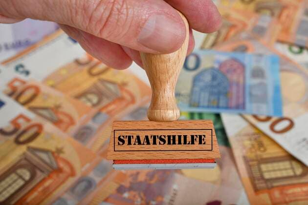 Symbol picture economic stimulus package, stamp with inscription STAATSTHILFE, Germany, Europe Copyright: imageBROKER/MichaelxWeber iblimw05795118.jpg