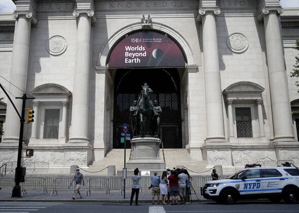 Police barricades surround the area around a bronze statue of former President Theodore Roosevelt at the American Museum Of Natural History in New York City on Monday, June 22, 2020. The statue of the 26th president flanked by walking Native American and African figures was unveiled to the public in front of the museum s Central Park West entrance in 1940. Statues in the United States and around the world have been knocked down, removed and vandalized as a debate swirls over monuments that represent possible racial oppression.  NYP20200622106 JOHNxANGELILLO