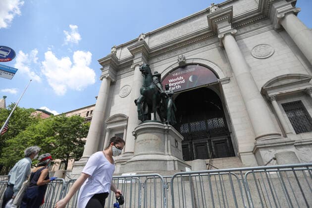 (200622) -- NEW YORK, June 22, 2020 -- A pedestrian walks past the statue of Theodore Roosevelt outside the American Museum of Natural History in New York, the United States, on June 22, 2020. The statue of Theodore Roosevelt atop a horse at the entrance to the American Museum of Natural History in New York City will be removed, due to the racial hierarchy it depicts, according to the museum. The bronze statue of the 26th president of the United States, flanked by an African American and a Native American, has been standing before the museum since 1940. ) U.S.-NEW YORK-THEODORE ROOSEVELT-STATUE-REMOVAL WangxYing 