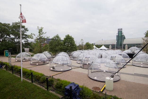(200623) -- TORONTO, June 23, 2020 -- Yoga domes are seen in Toronto, Canada, on June 22, 2020. A new pop-up event called Hot Yoga has been held in Toronto from June 21 to July 31. People can take part in yoga classes inside their own private dome to prevent the spread of COVID-19. (Photo by Xinhua) CANADA-TORONTO-COVID-19-YOGA DOMES ZouxZheng 