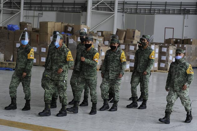 Military officers wear face masks while organizing medical supplies in the General Health Warehouse to be distributed in the country s various hospitals to treat patients infected with COVID-19. Where: Mexico City, Mexico When: 22 Jun 2020 Credit: Eyepix Cover Images **EDITORIAL USE ONLY** Copyright: xRicardoxCastelanxCruzx 40665358 EDITORIAL USE ONLY. NOT FOR USE BY NEWSPAPERS BASED IN THE UK.