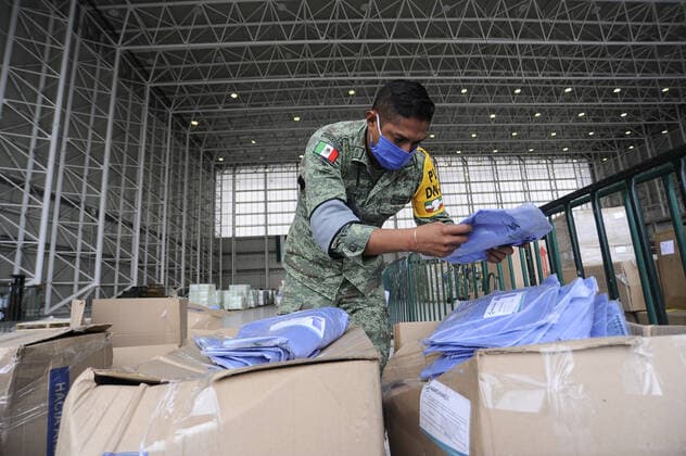 Military officers wear face masks while organizing medical supplies in the General Health Warehouse to be distributed in the country s various hospitals to treat patients infected with COVID-19. Where: Mexico City, Mexico When: 22 Jun 2020 Credit: Eyepix Cover Images **EDITORIAL USE ONLY** Copyright: xRicardoxCastelanxCruzx 40665360 EDITORIAL USE ONLY. NOT FOR USE BY NEWSPAPERS BASED IN THE UK.