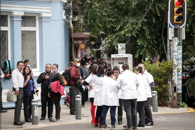(200623) -- MEXICO CITY, June 23, 2020 (Xinhua) -- People are seen on a street after an earthquake in Mexico City, capital of Mexico, on June 23, 2020. An earthquake with a magnitude of 7.4 jolted 12 km SSW of Santa Maria Zapotitlan of Mexico at 15:29:05 GMT on Tuesday, the U.S. Geological Survey said. (Xinhua Francisco Canedo) MEXICO-MEXICO CITY-EARTHQUAKE 