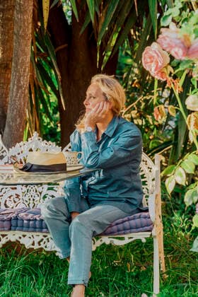 Portrait of senior woman sitting on garden bench looking at distance model released Symbolfoto property released ERRF03938
