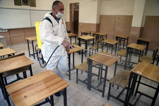 (200626) -- ANKARA, June 26, 2020 -- A cleaner disinfects a classroom that will be used for university entrance exams in Ankara, Turkey, on June 26, 2020. Turkey confirmed 1,396 new coronavirus cases and 19 fatalities in the past 24 hours, taking the total infection cases to 194,511 and the overall death toll to 5,065, Turkish Health Minister Fahrettin Koca tweeted on Friday. (Photo by Xinhua) TURKEY-ANKARA-COVID-19-CASES MustafaxKaya