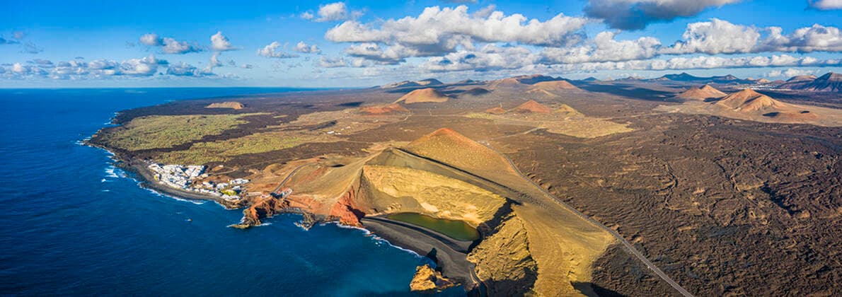 Aerial view of El Golfo village and the volcanic landscape of Timanfaya National Park, Lanzarote, Canary Islands, Spain, Atlantic, Europe Copyright: GavinxHellier 794-4820