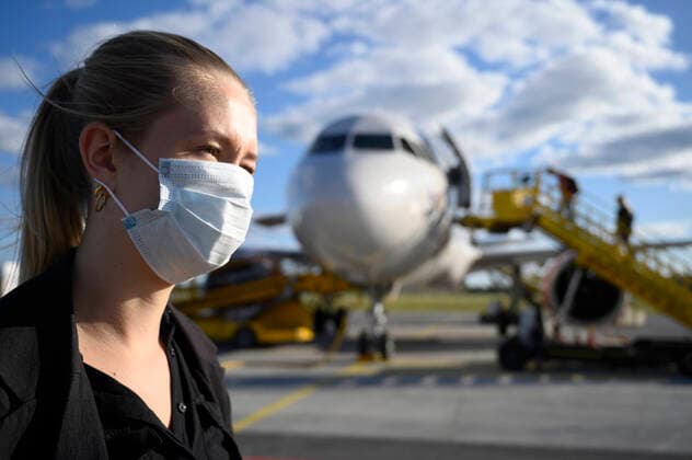 UMEA 20200701 Illustration picture of a woman wearing a protective face mask before boarding a domestic flight in Sweden. It is compulsory to wear a face mask when travelling with airline SAS, du to the corona pandemic (Covid-19). UMEA SWEDEN x10060x  Copyright: xHenrikxMontgomery TTx SWEDEN DOMESTIC TRAVEL