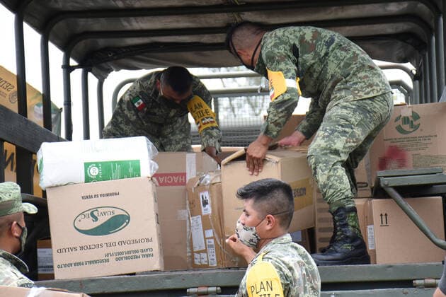 The Mexican Army unload medical supplies at Merida International Airport to help hospitals battle COVID-19. The Secretary of National Defense has moved 4,914,06 tons of medical supplies in different states of the country to face this pandemic. Where: Chetumal, Mexico When: 05 Jul 2020 Credit: Eyepix Cover Images **EDITORIAL USE ONLY** Copyright: xIlianaxSuarezx 40698021 EDITORIAL USE ONLY. NOT FOR USE BY NEWSPAPERS BASED IN THE UK.